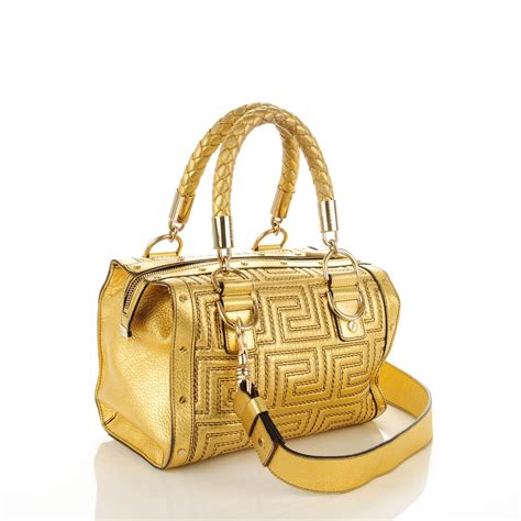 gold versace backpack|Versace black shoulder bag.